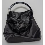 A Gucci lady's silver satin evening bag, of hoop drawstring design,