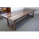 An 18th century and later oak refectory table with cleated plank top on four turned supports united