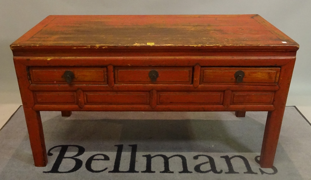 An early 20th century red painted Chinese low side table with three short drawers on block supports, - Image 2 of 3