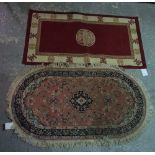 A machine made rug of Chinese design, 150cm x 80cm, and a machine made rug of pink floral design,