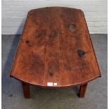 A 19th century French fruitwood oval drop flap table on tapering square supports,