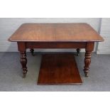 A William IV mahogany extending dining table, on fluted baluster supports with one extra leaf,