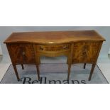 A 20th century mahogany serpentine sideboard with single drawer flanked by pair cupboards,