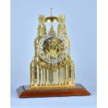 A late Victorian 'York Minster' brass Skeleton clock With twin chain fusee movement with anchor
