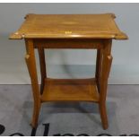 An Edwardian inlaid mahogany two tier occasional table, 62cm wide x 70cm high.