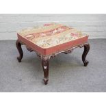 A Victorian rosewood square footstool with carved frieze on four scroll supports,