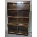 A 20th century four section walnut Minty modular bookcase, 86cm wide.
