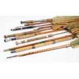 A group of seven vintage fishing rods, to include a Hardy 'Palakona' two piece split cane rod,