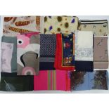 A collection of twelve designer and printed various silk scarves,
