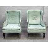 A pair of aqua green leather upholstered mid-20th century wingback easy armchairs,