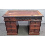 A carved oak kneehole desk, early 20th century, in period style,
