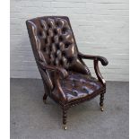 An early Victorian style mahogany framed open armchair, with brown leather upholstery,