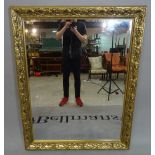 A modern gold painted rectangular wall mirror with bevelled glass, 108cm, wide x 136cm high.
