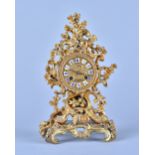 A French giltmetal mantel clock In the Louis XV style,