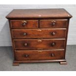 An 18th century oak chest of two short and three long graduated drawers on square bracket feet,