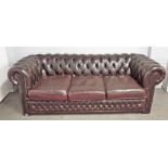 A 20th century brown leather upholstered buttonback Chesterfield sofa on block feet,