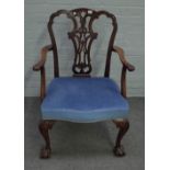 A mid-18th century style mahogany open armchair with serpentine seat and claw and ball feet,