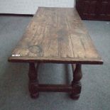 A 17th century and later oak refectory table, the cleated top on baluster turned supports,