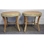 A pair of parcel gilt green painted oval occasional tables on four splayed supports,