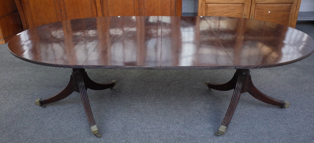 A George III mahogany oval extending dining table,