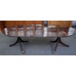 A George III mahogany oval extending dining table,