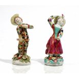 A matched pair of Bow figures of children dressed as Harlequin and Columbine, circa 1760,