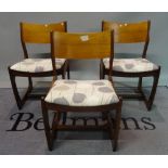 A set of four G-plan style teak dining chairs with upholstered seats, 47cm wide x 47cm high.