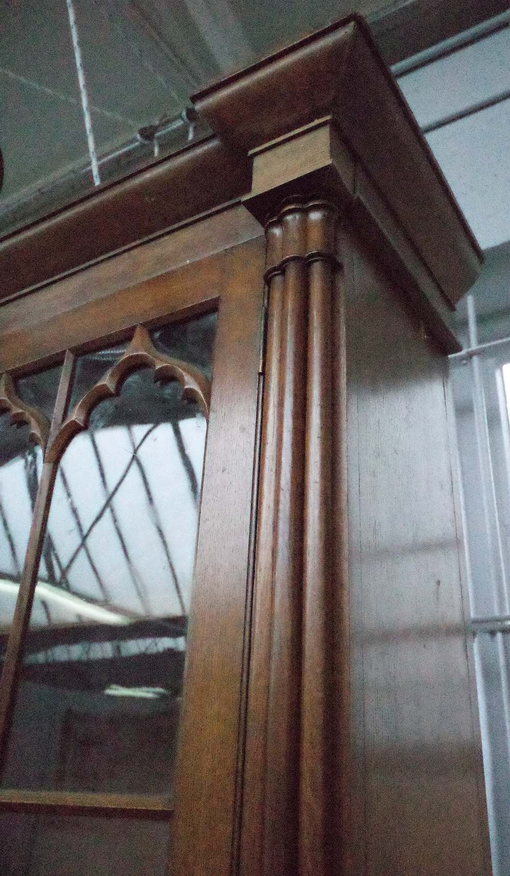 A Victorian oak Gothic revival bookcase cabinet with four arched astragal glazed doors divided by - Image 4 of 6