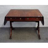 A George III mahogany sofa table, with opposing opposite frieze drawers, on four downswept supports,