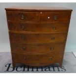 An early 19th century mahogany bowfront chest of five long graduated drawers,
