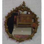 A Victorian style giltwood circular wall mirror, 67cm wide x 80cm high.