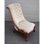 A Victorian walnut slipper back easy chair on scroll supports, 58cm wide x 92cm high.