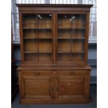 A late 19th century mahogany bookcase cabinet, with pair of glazed doors over drawers and cupboards,