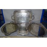 Silver plated wares, comprising seven twin handled serving trays, the largest 62cm wide, (7).