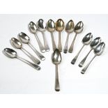 Thirteen sliver Old English pattern dessert spoons, various makers and dates,