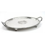 A George III silver oval twin handled tray, engraved with an armorial to the centre,