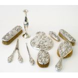 A Sterling silver mounted lady's eight piece dressing set, comprising; a hand mirror, a hairbrush,