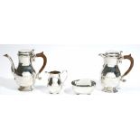 A silver four piece tea /coffee set, comprising; a coffee pot and a hot milk/hot water jug,