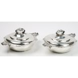 A pair of French twin handled vegetable dishes and covers,