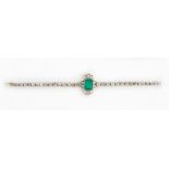 An emerald and diamond bracelet mounted with the cushion cut emerald to the centre,