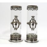 A pair of European silver plated metal mounted cylindrical glass vases,