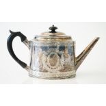 A George III silver teapot, of tapered oval form, with engraved decoration,