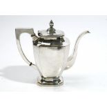 A European coffee pot, having stippled decoration and with a plain angular handle,