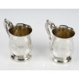 A pair of silver mugs, each of baluster form,