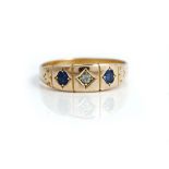 A 15ct gold, diamond and sapphire three stone ring,