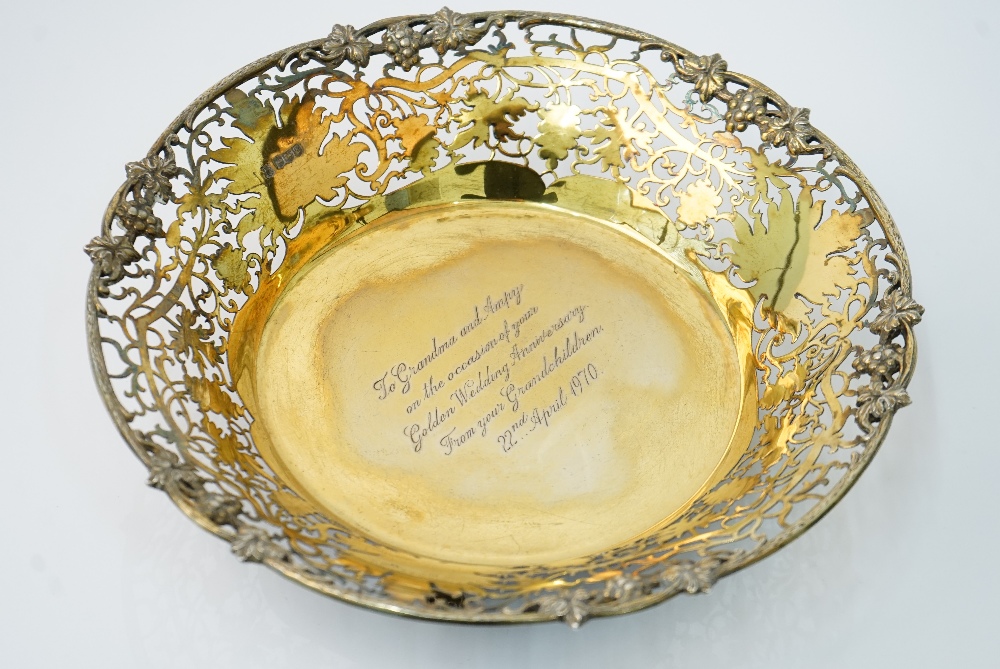 A silver gilt dish, of shaped circular form, cast and pierced with a border of fruiting vine, - Image 2 of 3