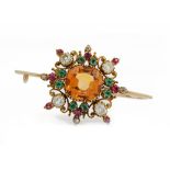 A late 19th/early 20th entury topaz, emerald, ruby and diamond brooch,