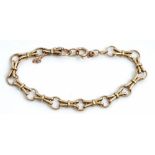 A 9ct gold bracelet in a circular and twin bar link design, on a boltring clasp, length 18.