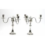 A pair of Portuguese three light table candelabra,