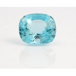 An unmounted cushion cut aquamarine, weight approximately 48cts, displayed in a box.